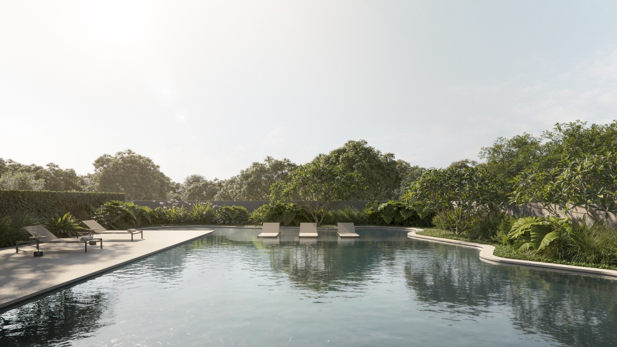 Piscina com raia e paisagismo integrado ao entardecer